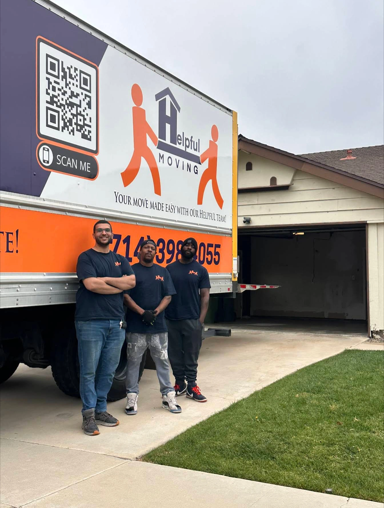 Professional movers carrying couch